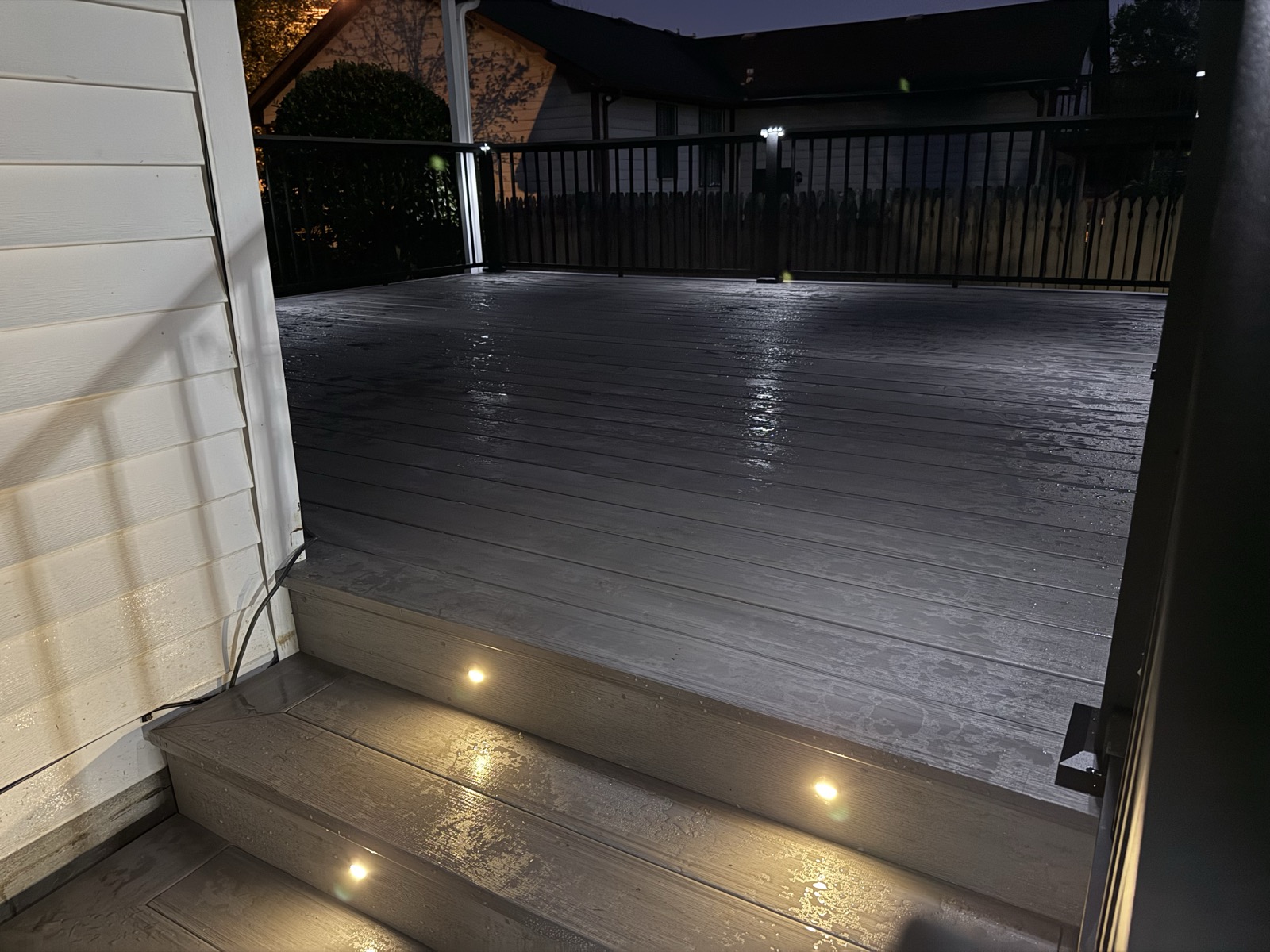 Composite stairs at night with glowing recessed riser lights